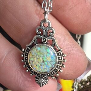Elegant Silver Pendant with Iridescent Stone